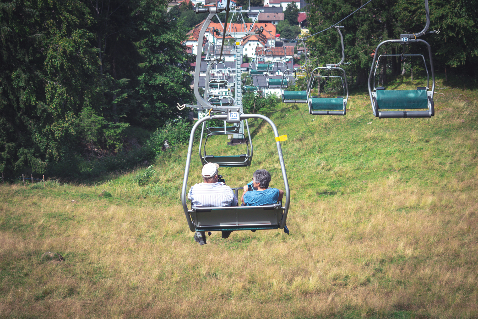 summerfun - Blue Water Homecare older couple on ski lift in summer
